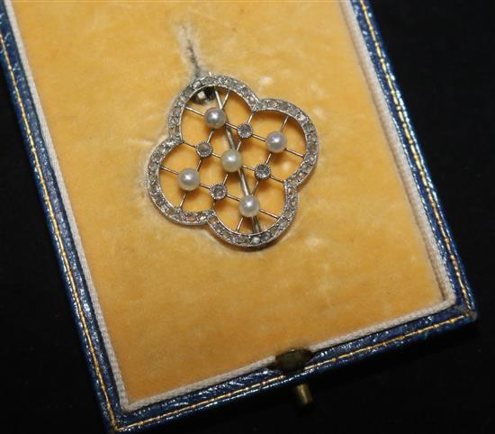 An Edwardian white gold diamond and pearl trellis pattern brooch, 26mm.